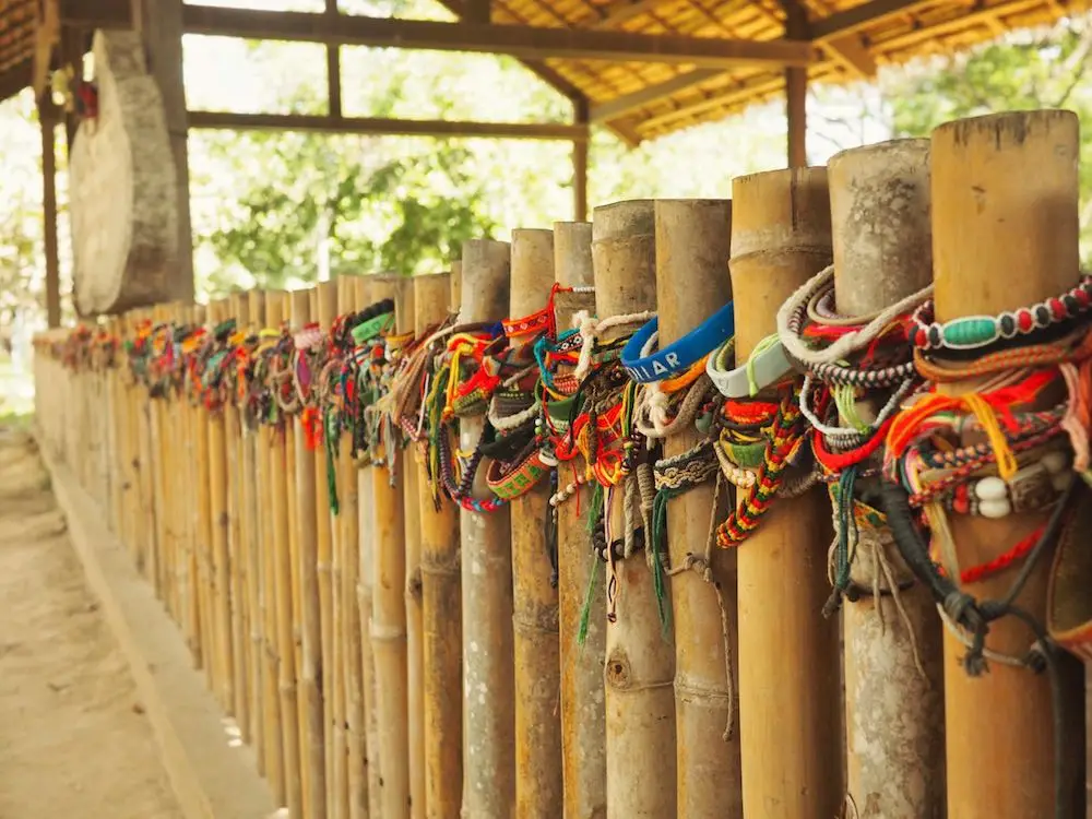 Friendship bracelets adorn a mass grave