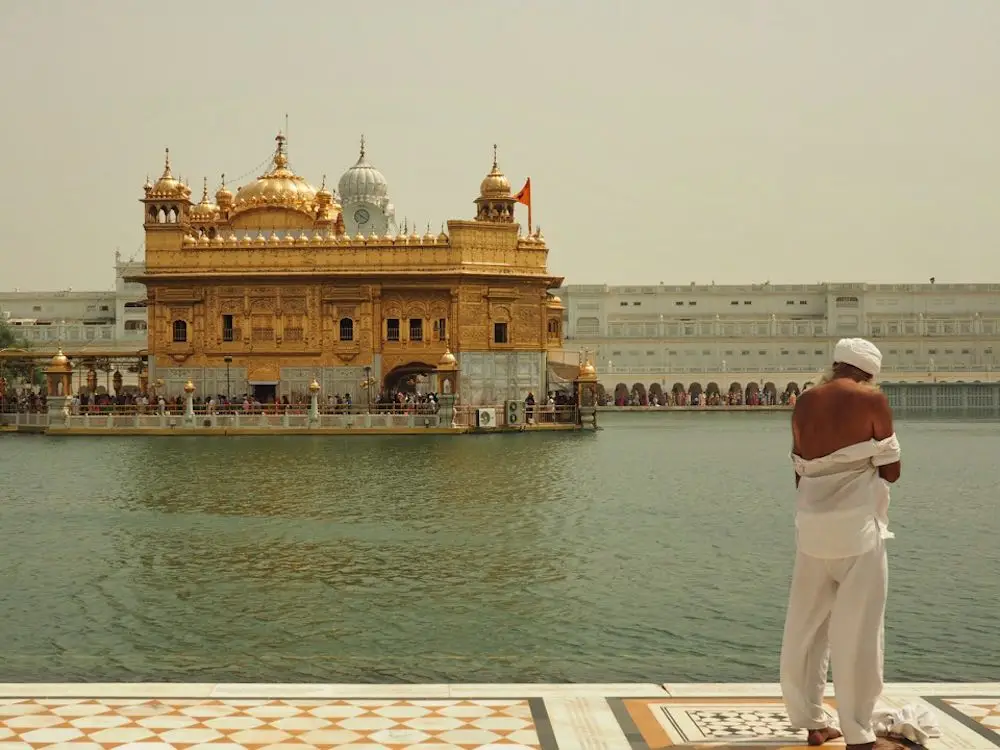 A pilgrim disrobes at the Golden Temple