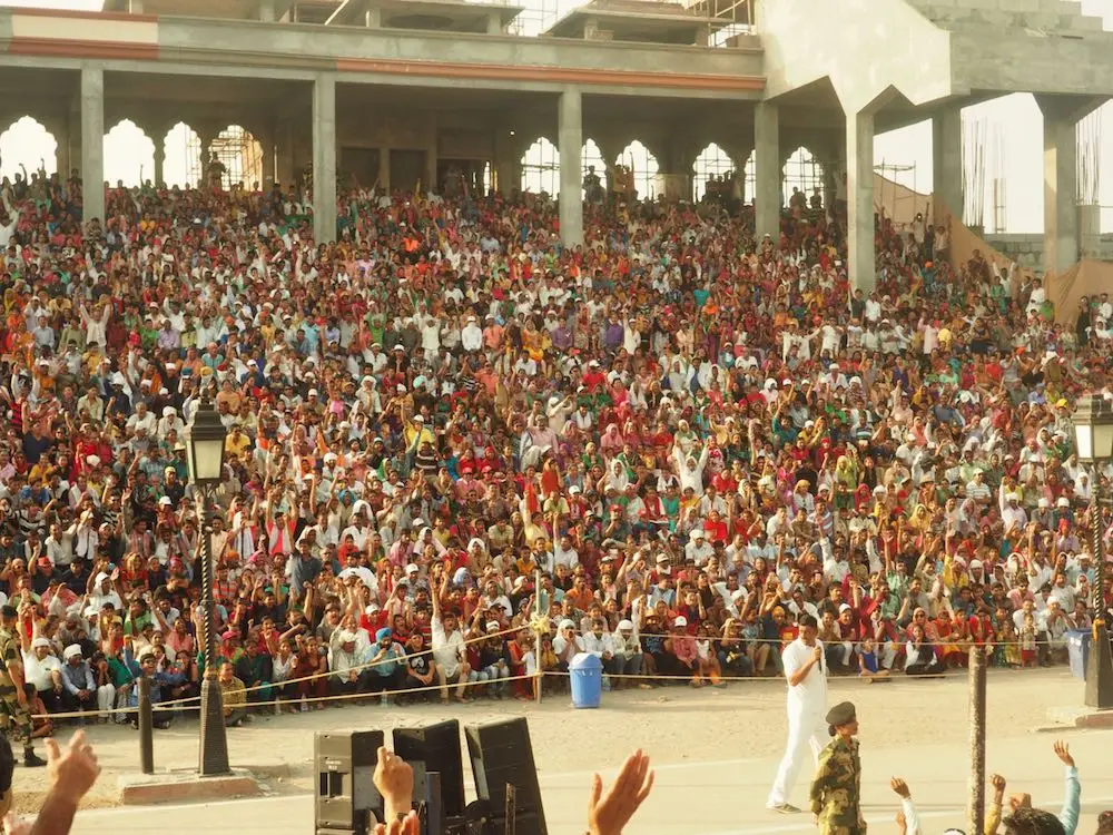 The crowd being warmed up at the Wagah Border Crossing