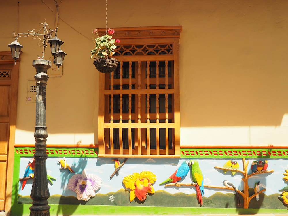 Exploring Guatape - house with parrot zocalos