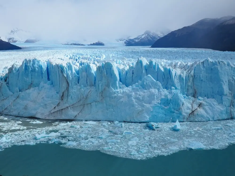The glacier as seen from the boardwalk with icebergs in the foreground