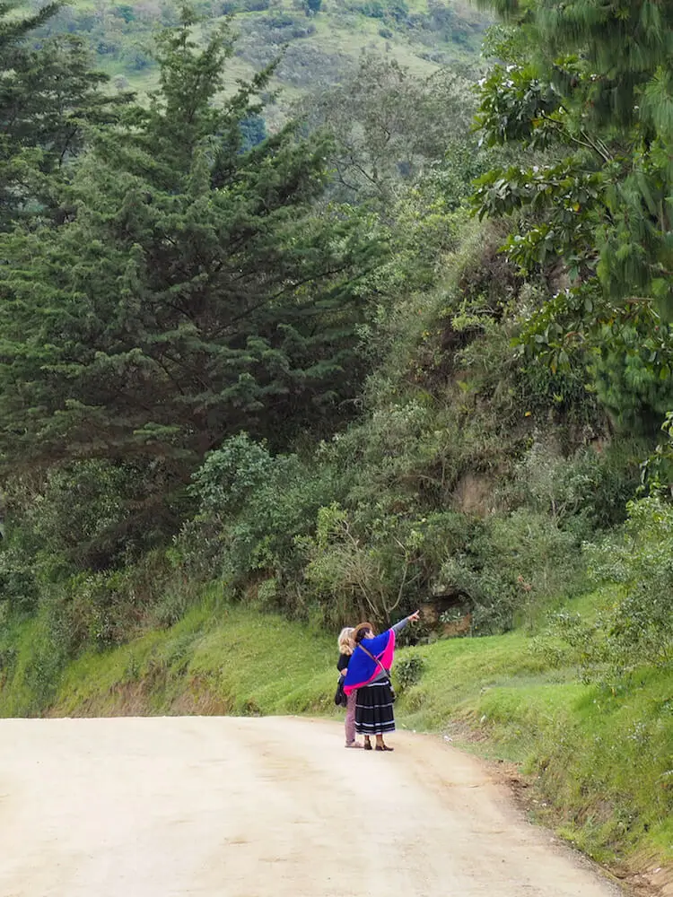 Maria points out a cave in the hillside to Nicky