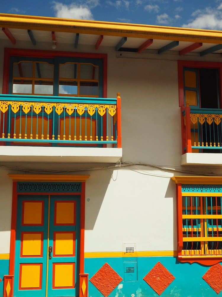 House painted in turquoise, red, yellow, white
