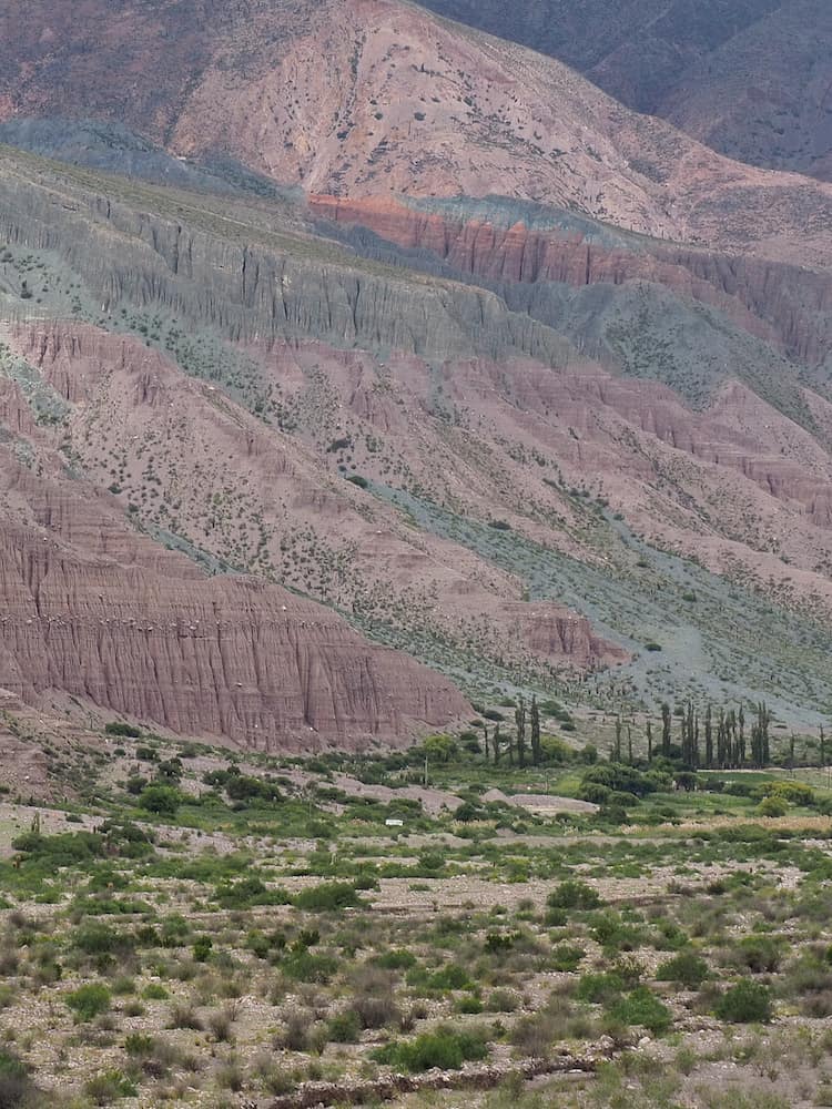 Green and red hills beside Purmamarca