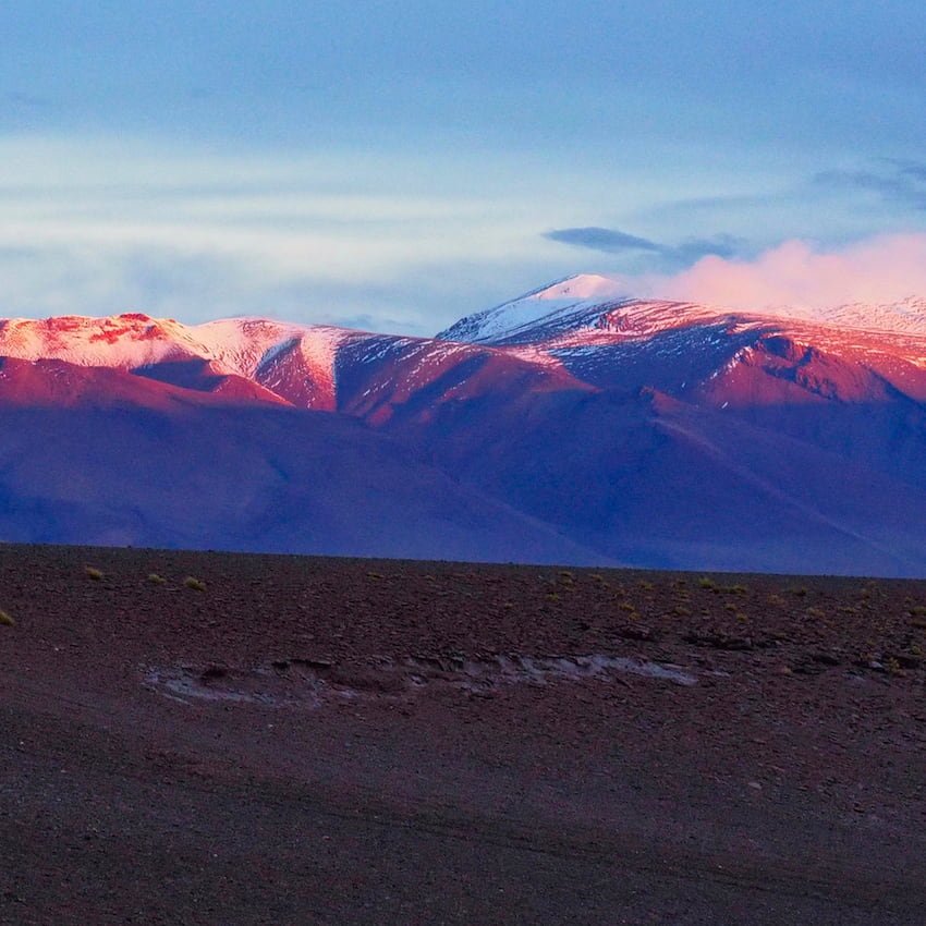 Mountains are lit up in red by the morning sun
