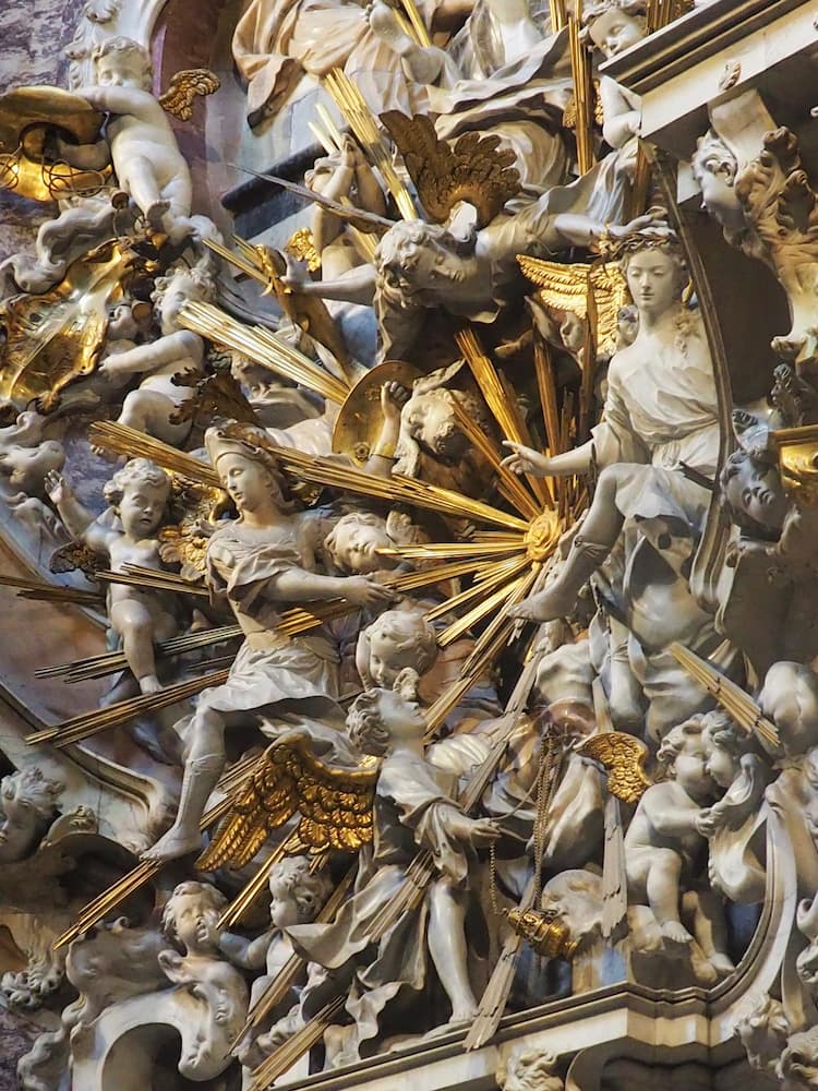 A cathedral sculpture including a variety of angel figures