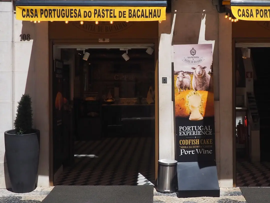 A shop entrance with a yellow banner running along the top