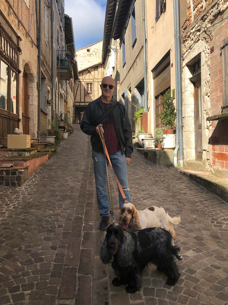 Ian with two dogs on leads