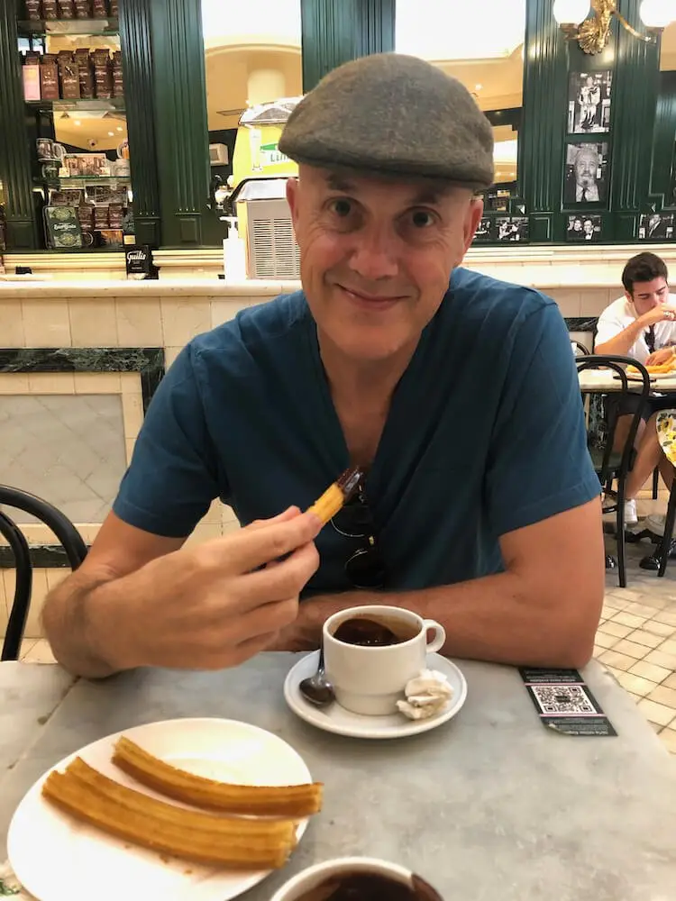 Ian about to eat a chocolate churro