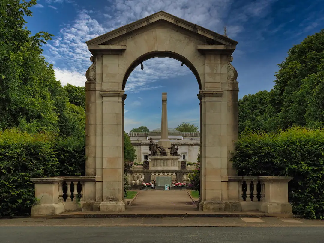 A store arch leads to a memorial garden