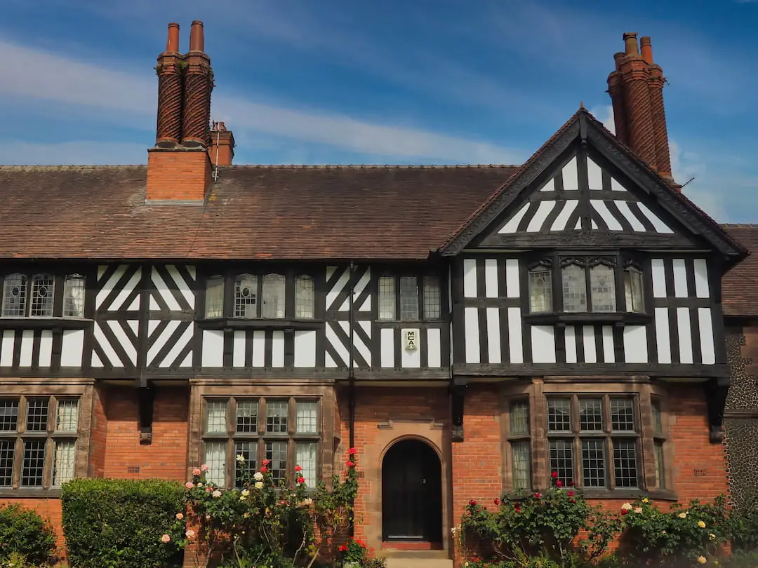 Sandstone building with half-timbered facade on the first floor