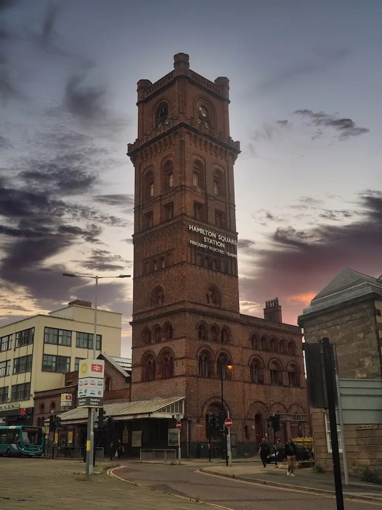 A sandstone building with a tower