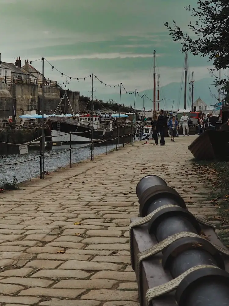 Charlestown Harbour cannon, Cornwall. A cannon points beyond the harbour at Charlestown, Cornwall