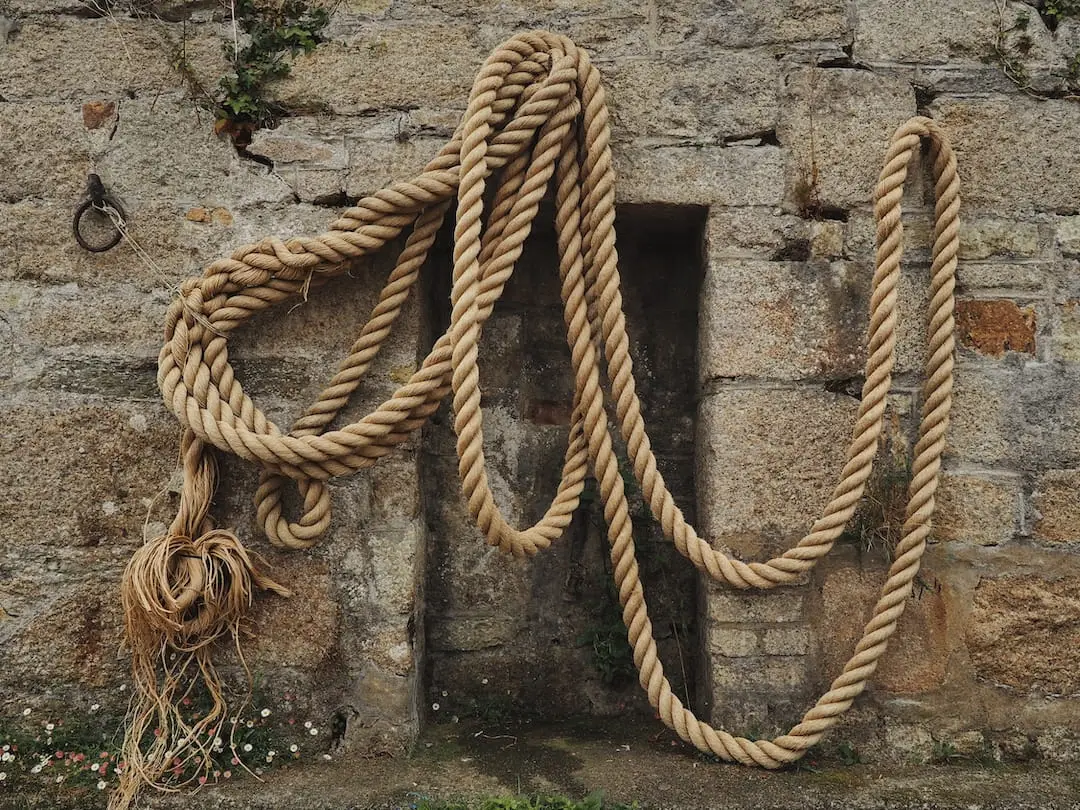 Charlestown Harbour ropes, Cornwall A rope hangs on the stone wall of Charlestown harbour