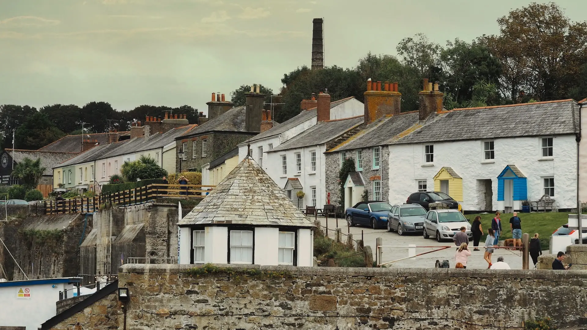 Charlestown Harbour - view of Quay Road cottages, Cornwall. Pastel coloured fishermen's cottages line the street beside Charlestown Harbour