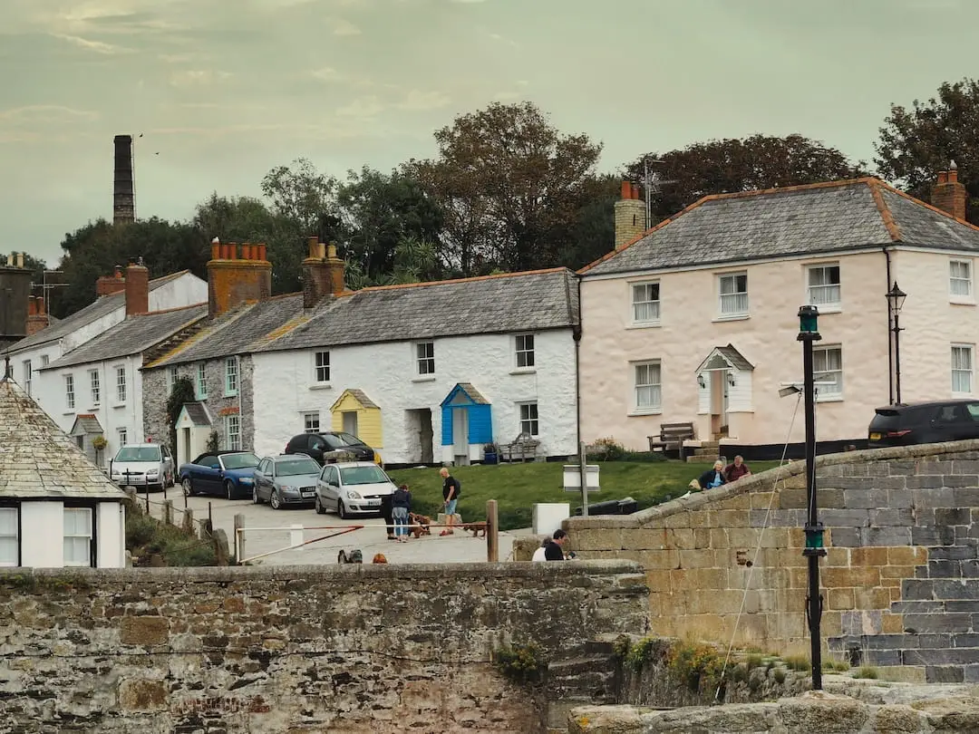 Charlestown Harbour - view of Quay Road cottages, Cornwall Pastel coloured fishermen's cottages line the street beside Charlestown Harbour