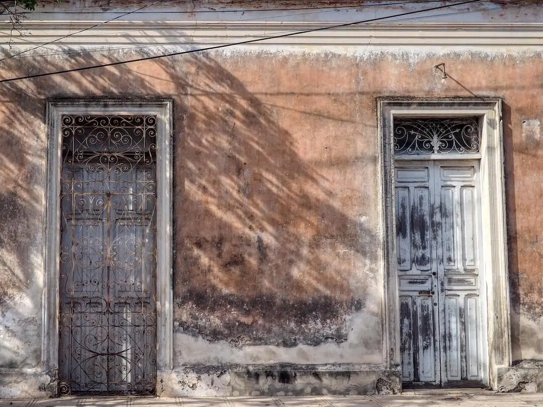 An orange building with two light-blue doors