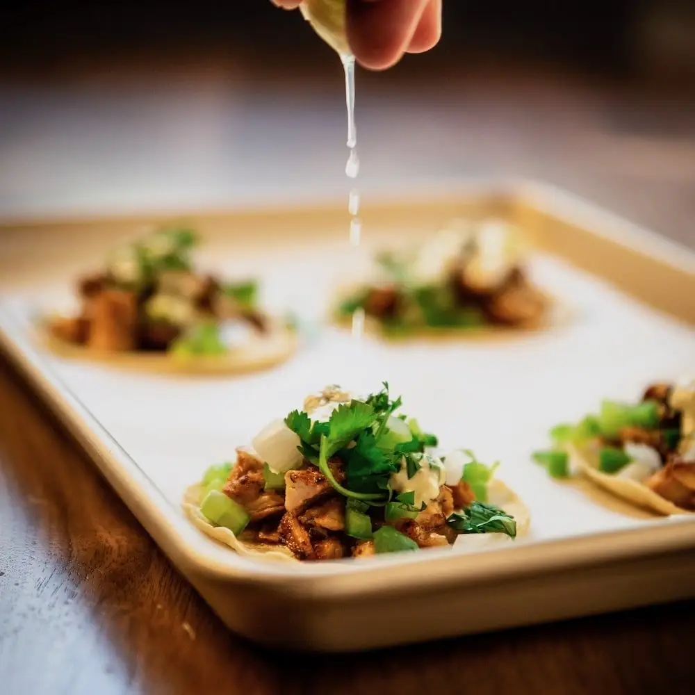 Four tacos on a plate