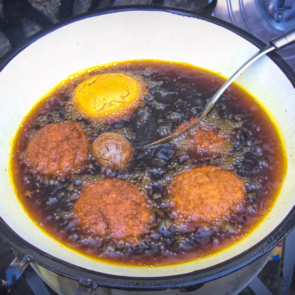 Acaraje patties cooking in dende oil - Bahia Brazil Acarajé patties frying in dênde oil
