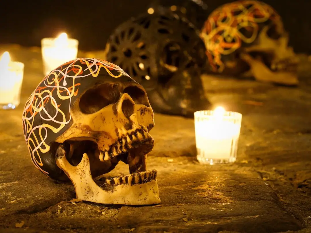 Day of the Dead display in Oaxaca - Mexico Oaxaca Day of the Dead - lit candles and skulls in a public display
