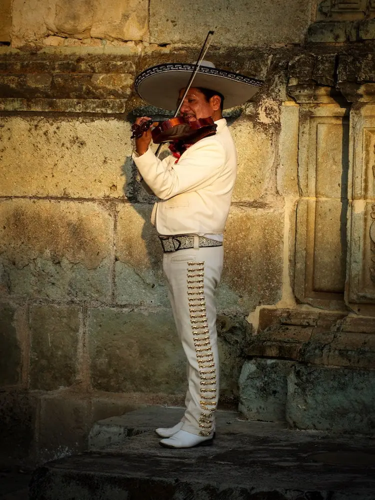 Mariachi player in Oaxaca Mexico A man dressed in traditional mariachi clothes plays a violin