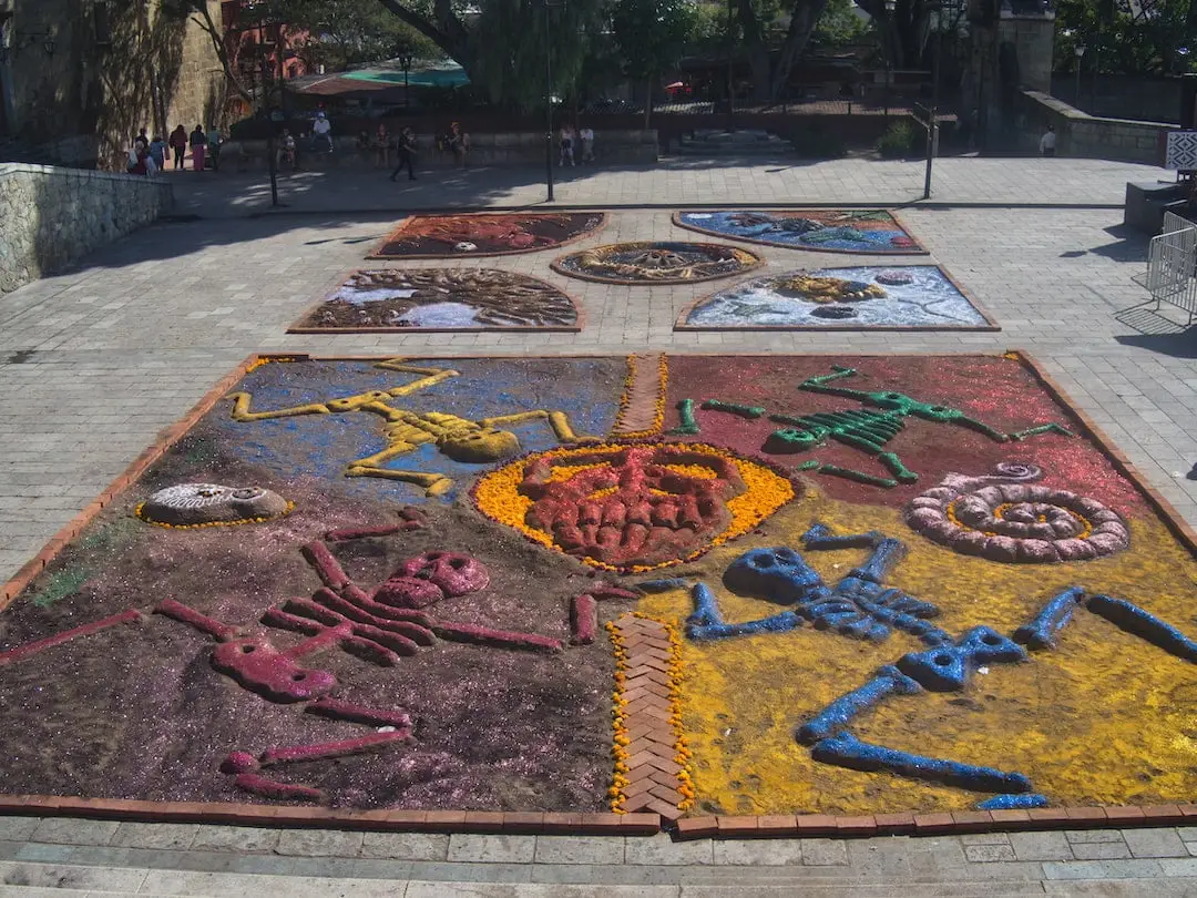 Sand art in Oaxaca A square of sand art featuring figures in various colours