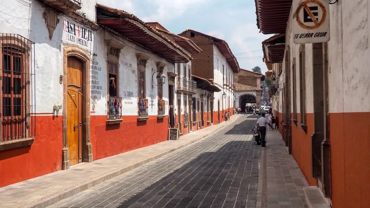 A street with red and white buildings on either side