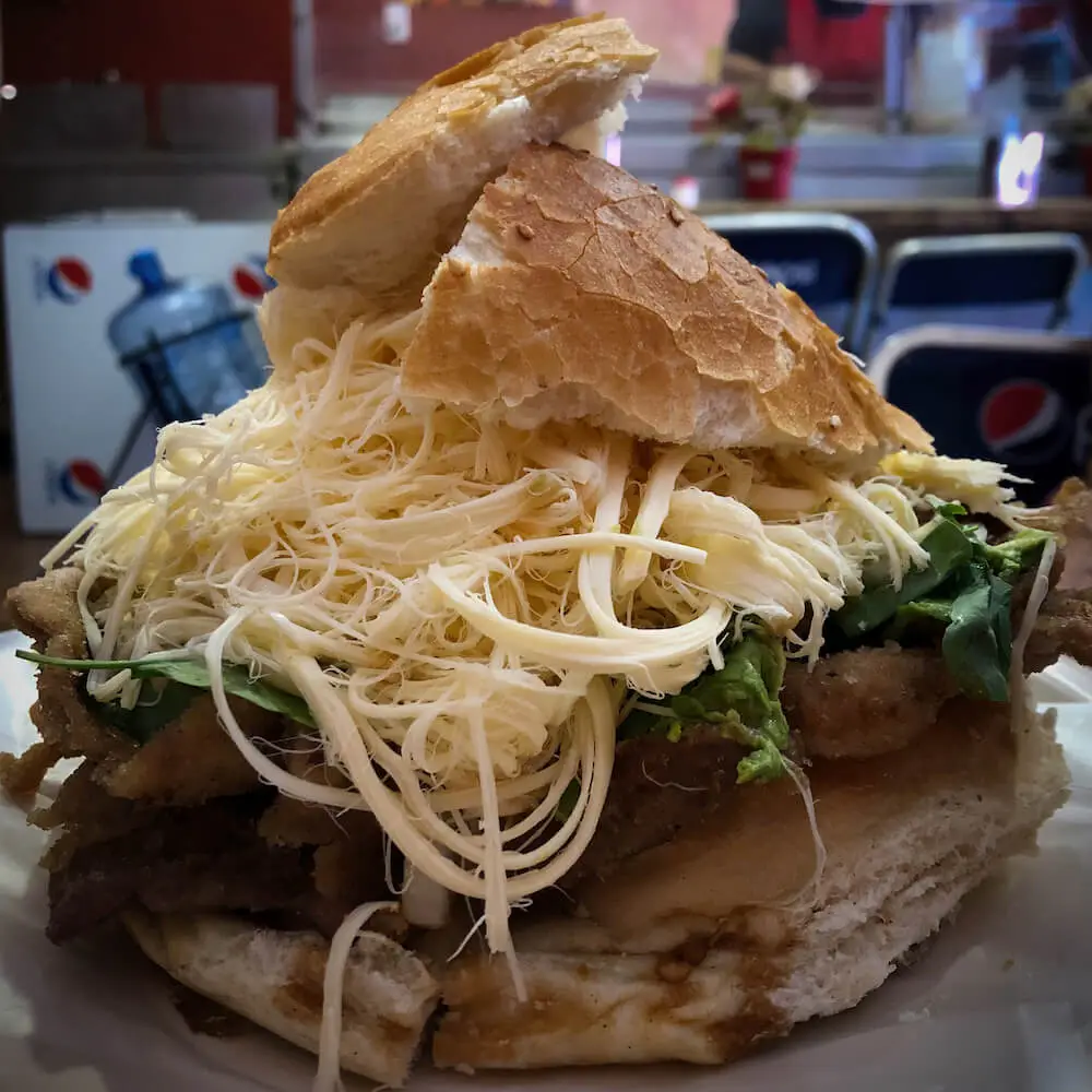 Cemita - Puebla Mexico A bread roll stuffed with meat and stringy cheese
