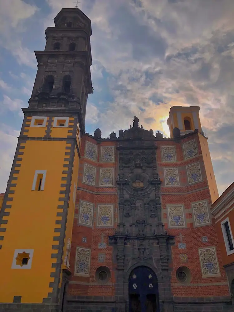 Ex-Convento de San Francisco Puebla Mexico Church with yellow tower and red facade