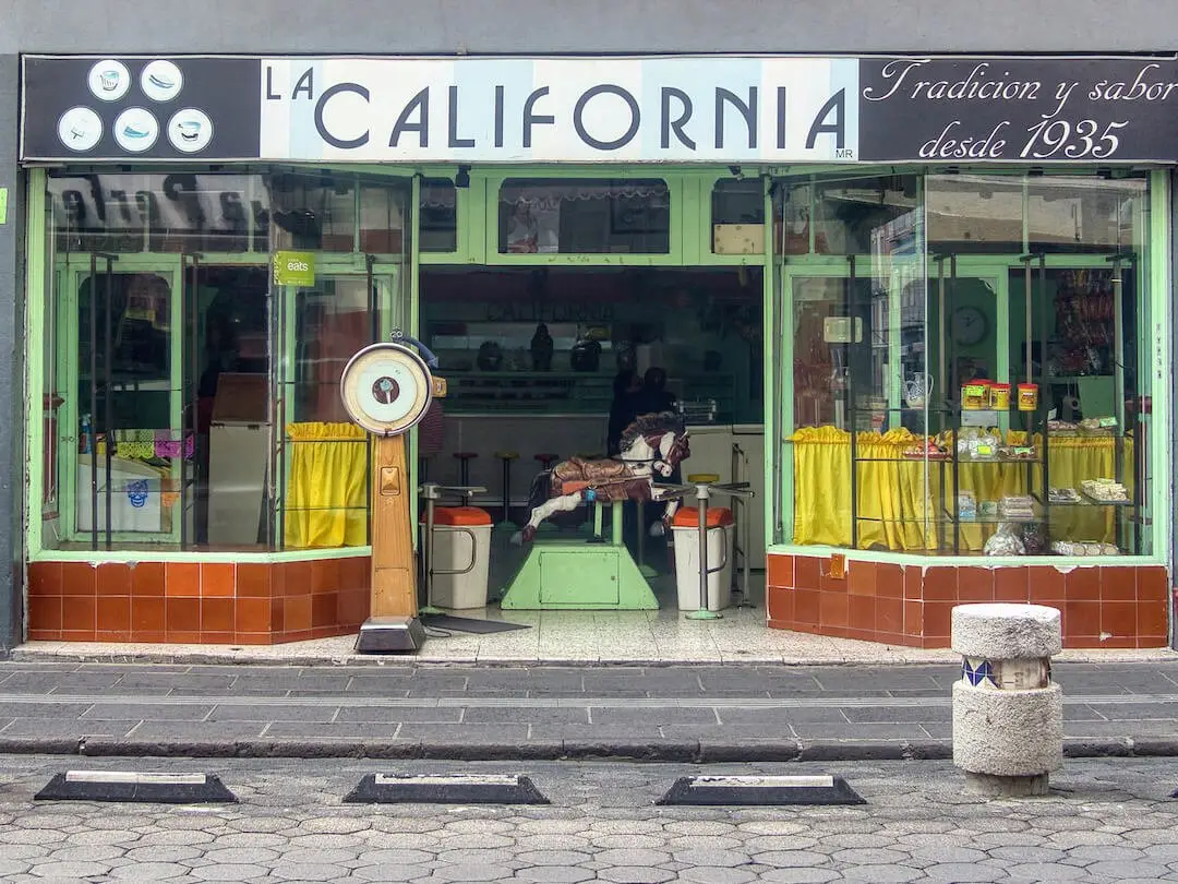 La California - Puebla Mexico Shop front with green framed windows and doors