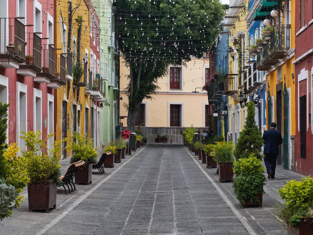 Puebla walking tour - a pedestrianised street with colourful buildings on either side