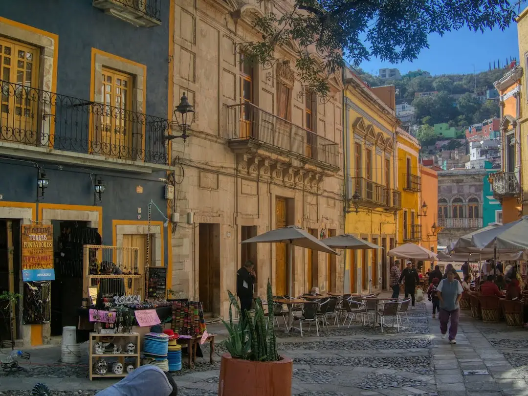 A row of restaurants with outside seating