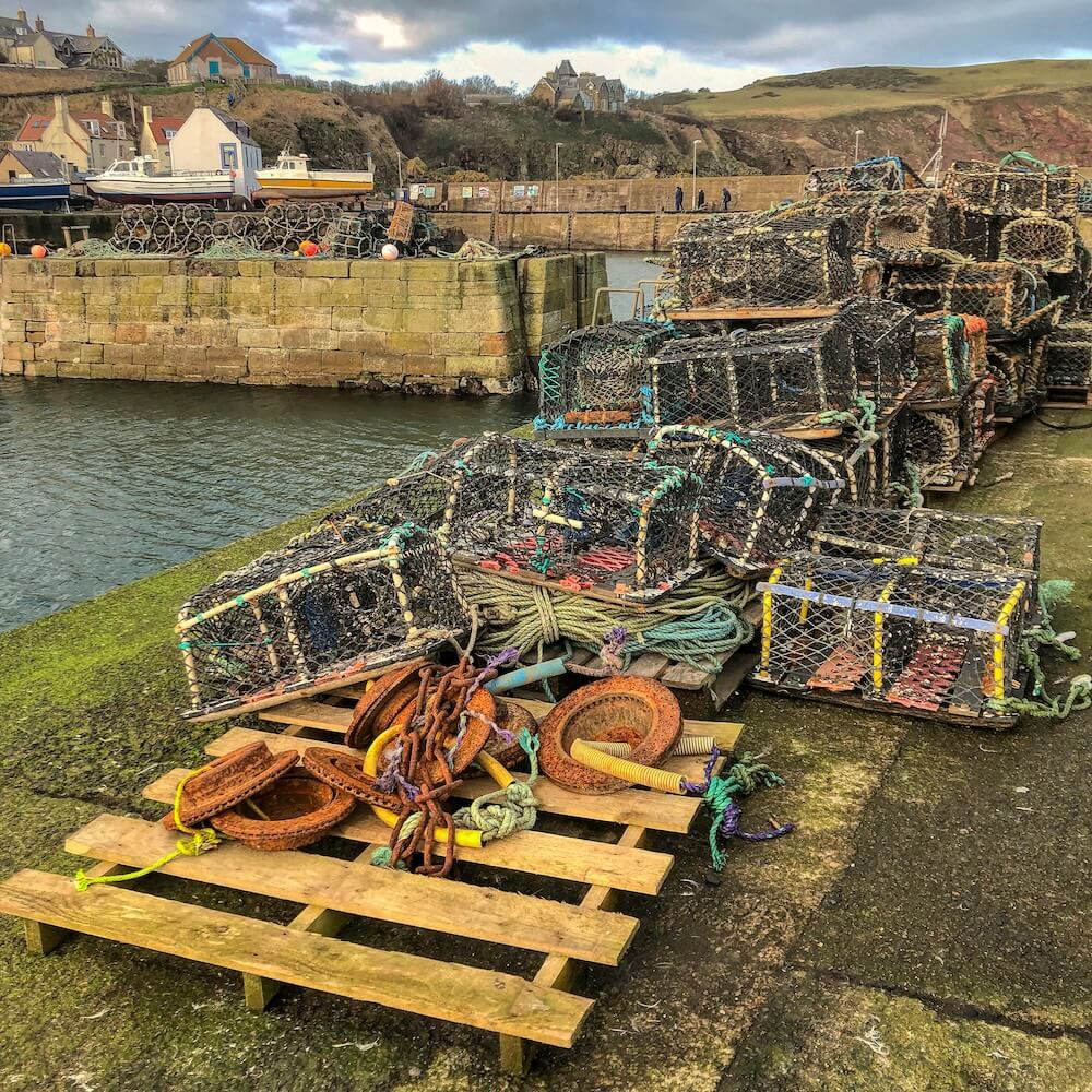 Crab and lobster pots stacked in a harbour