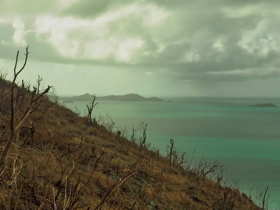 Hurricane Irma in BVI - Bare Hills The remains of storm clouds behind a barren hillside