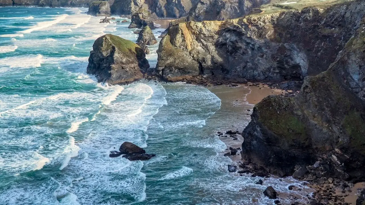 Bedruthan Steps - Cornwall - UK Cliffs, a beach, free-standing rocks and white surf