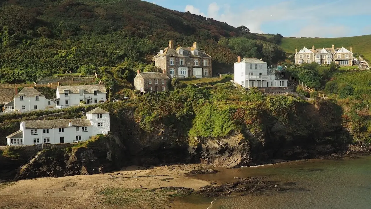 Port Isaac - Cornwall - England White cottages overlook cliffs to a sandy beach