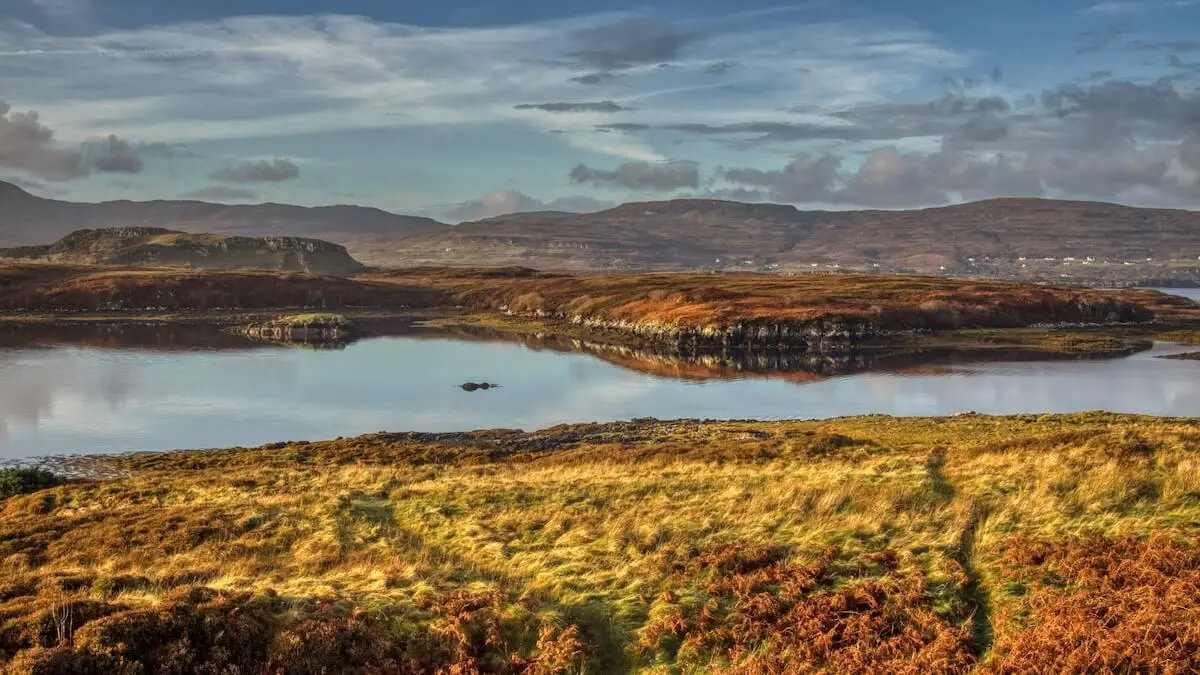 Marshland and mountains are separated by a loch